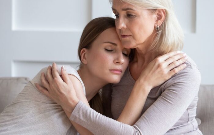 Loving senior mother hug adult daughter