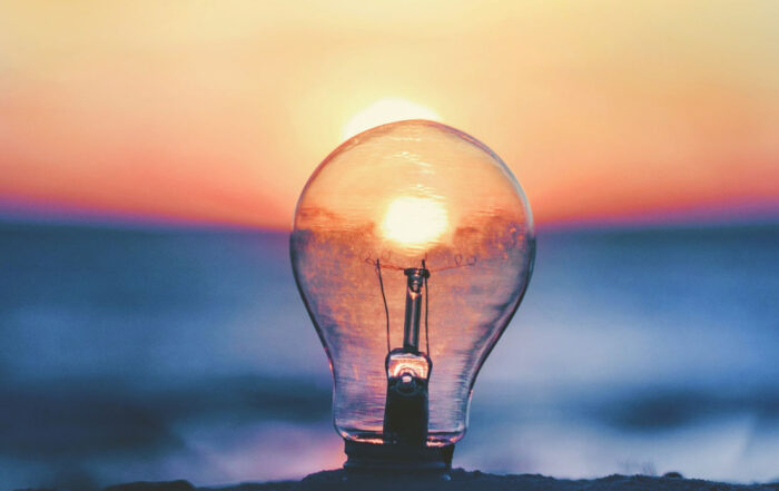 Lightbulb in front of sunset